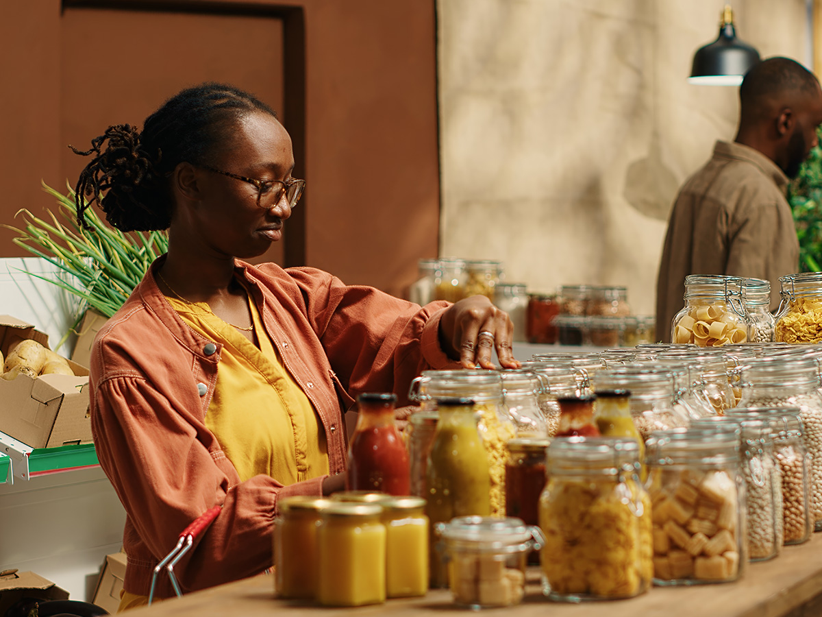 Halal grocer arranging pantry jars