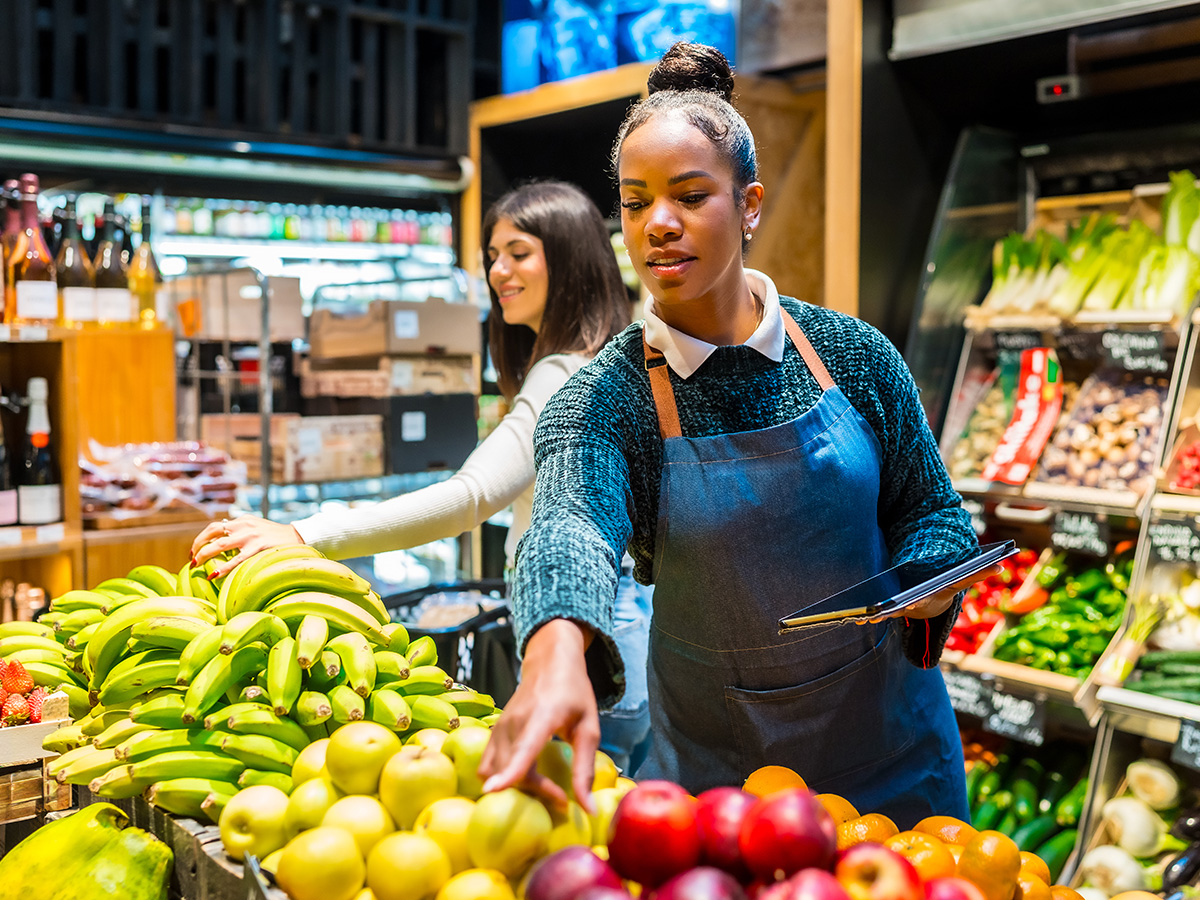 Halal grocer arranging fresh produce